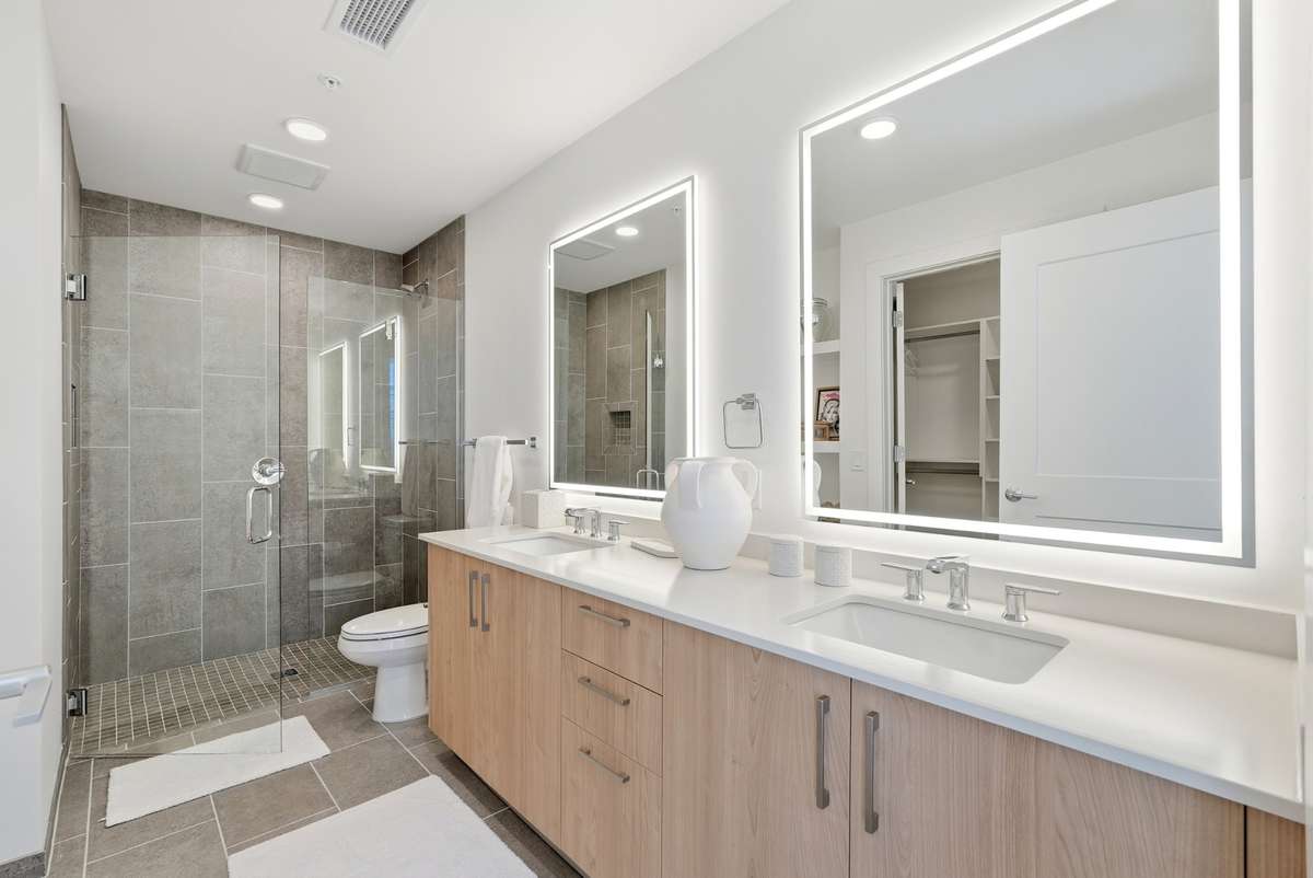 Large double vanity and back lit mirrors make it feel spa like.