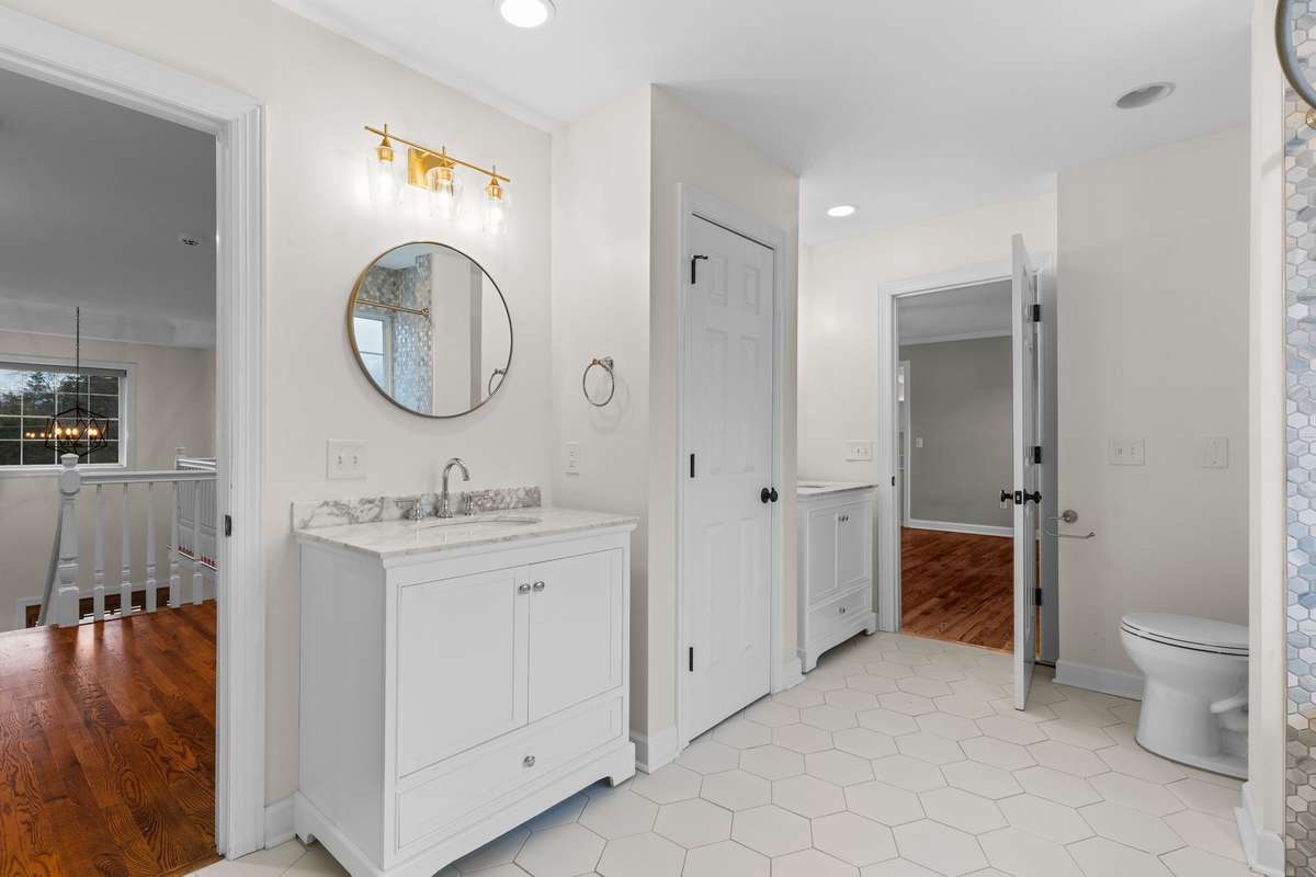 Renovated upstairs bath accessible from the hallway as well as one of the bedrooms.