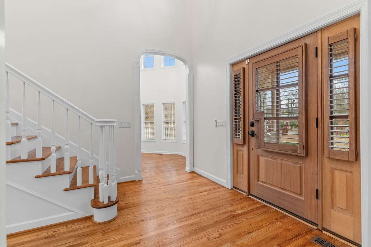 Foyer/Entry way features new custom shutters for front door