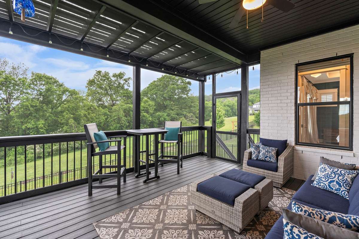 Covered and screened in back patio with Trex decking
