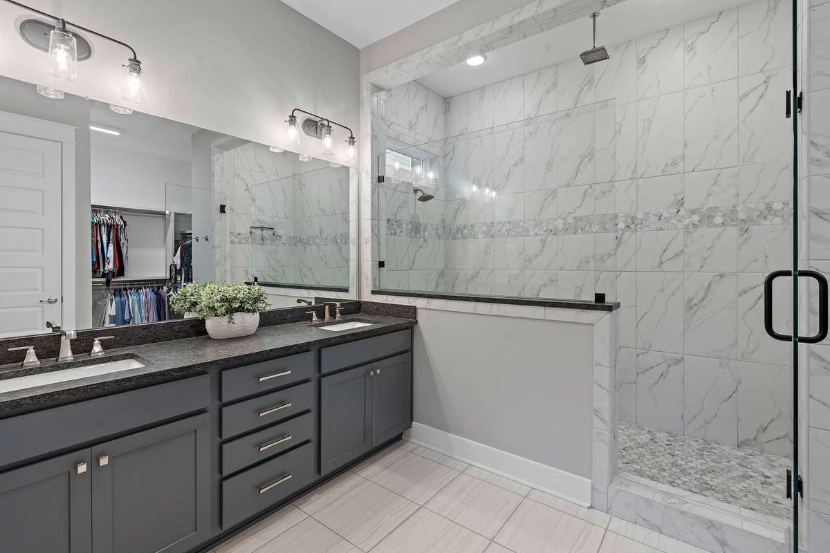 Primary bath with a huge walk in shower with two shower heads