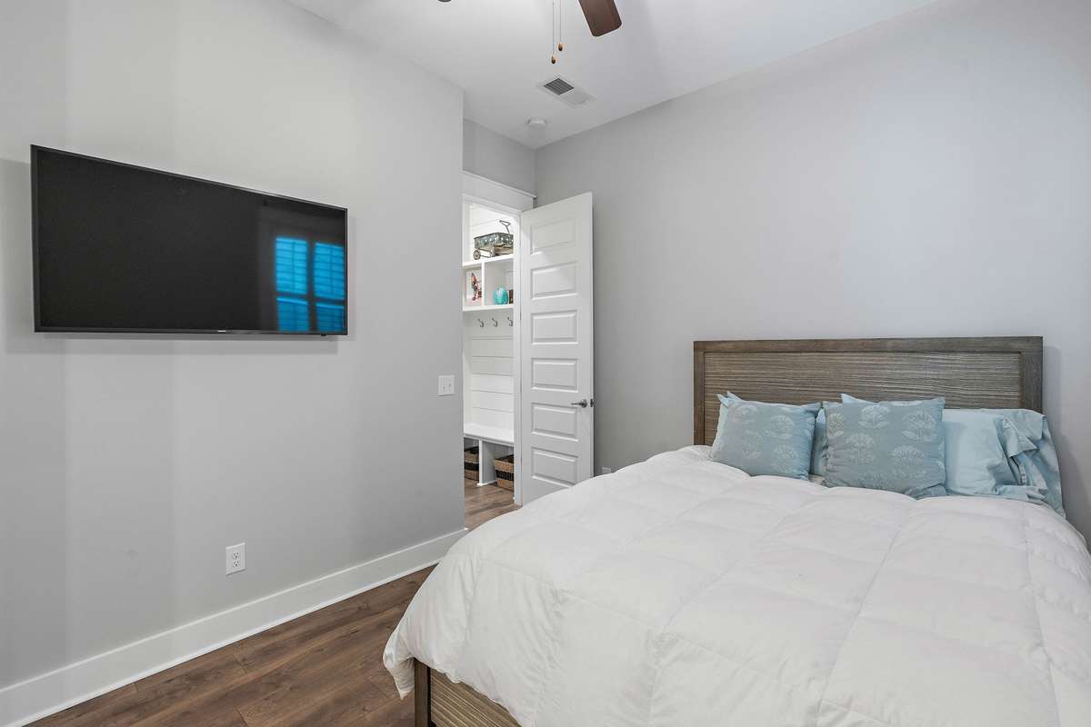 Bedroom #2 that has its own bathroom and closet next to the garage