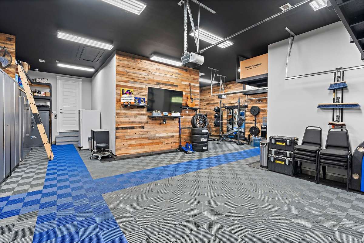 Climate controlled 4 car tandem garage. Every guys dream can come true here! I love this whole thing!