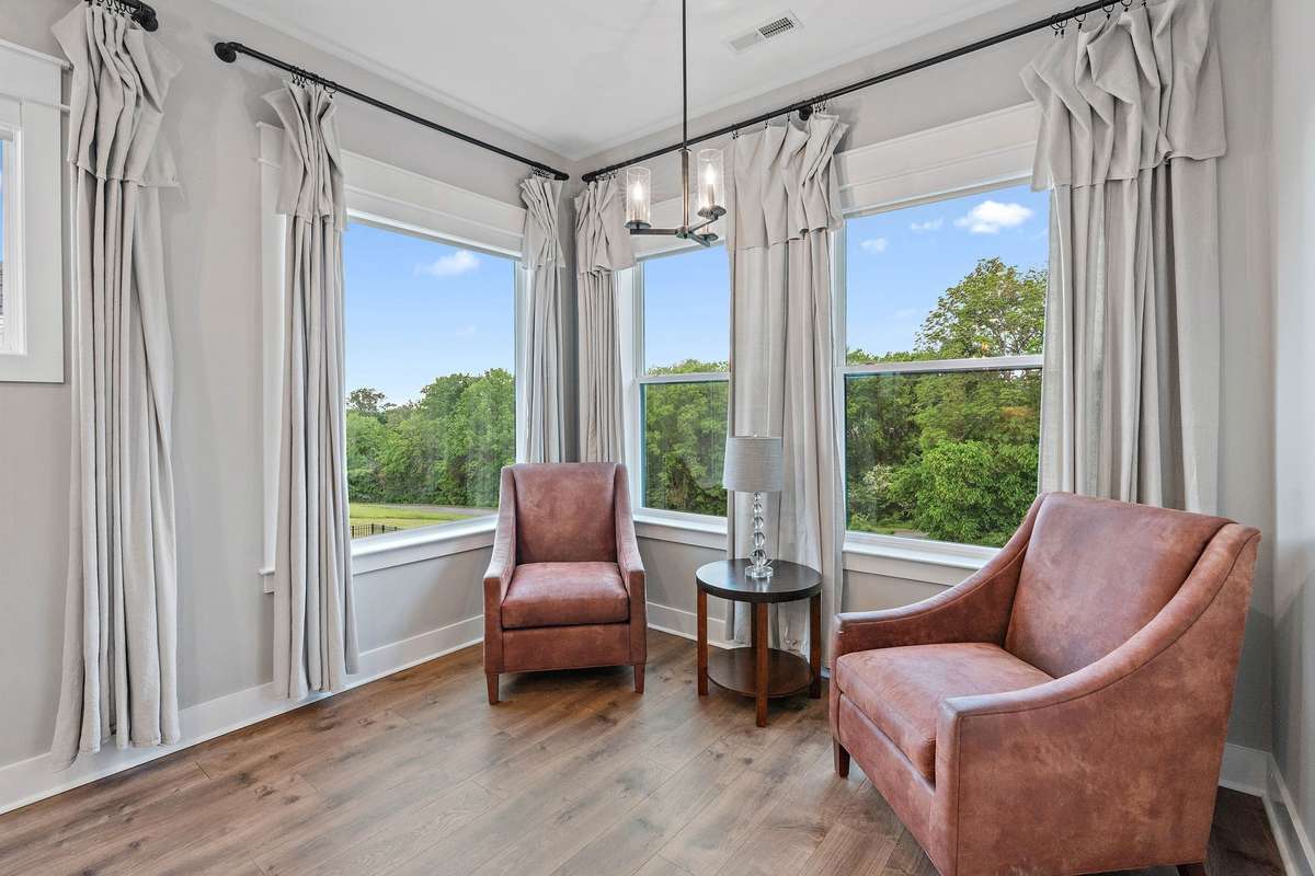 Love this sitting area looking back out to the tree lined backyard