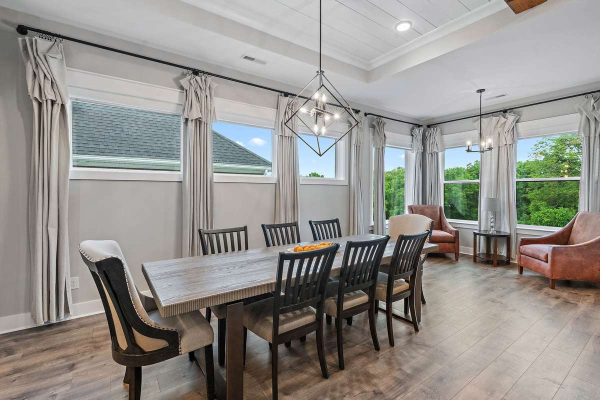 Dining and sitting area with lots of windows