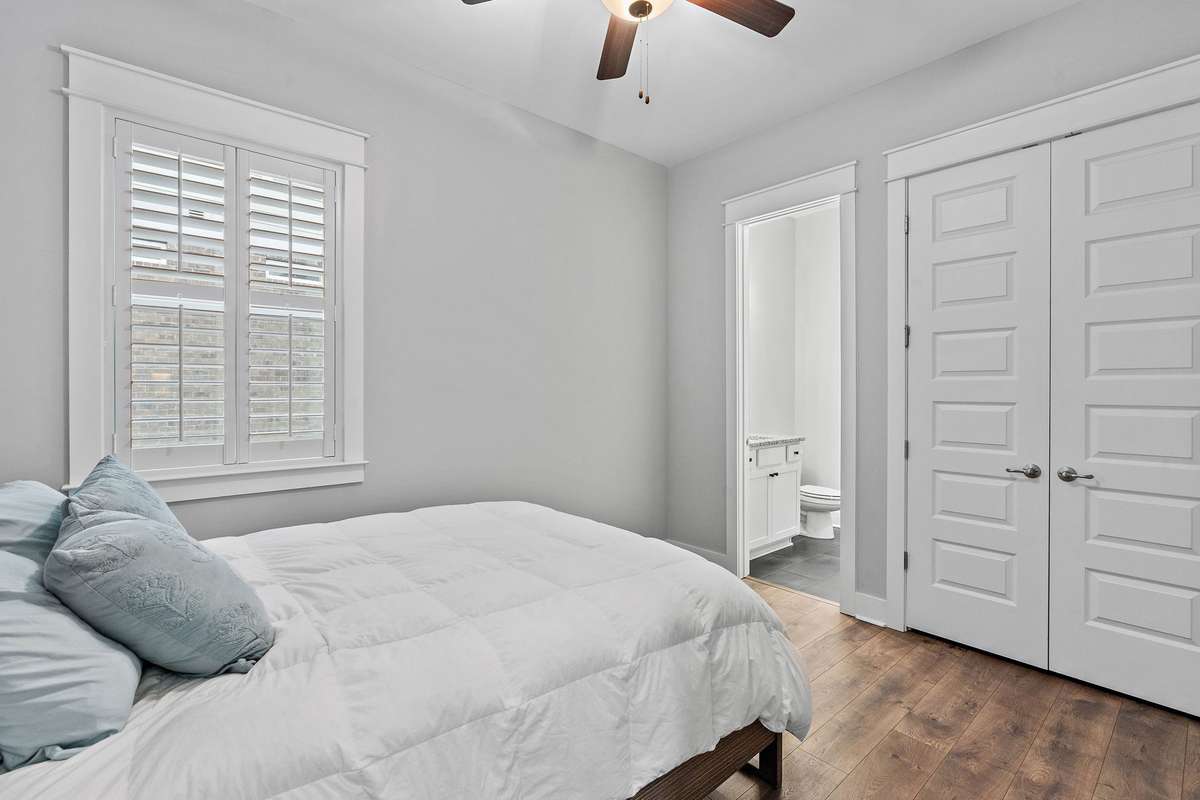 Bedroom #2 that has its own bathroom and closet next to the garage