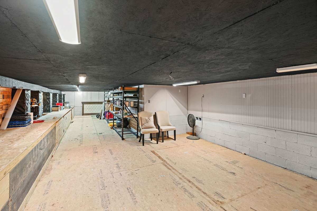 Crawl space workshop. Over 700+ square feet of space for wood working, storage, etc.