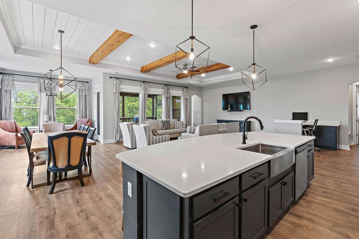 View to the living area from the corner of the kitchen. Look at the size of that island!