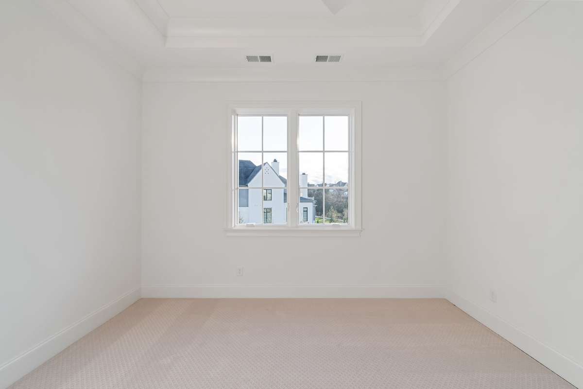 One of three bedrooms on the upper level