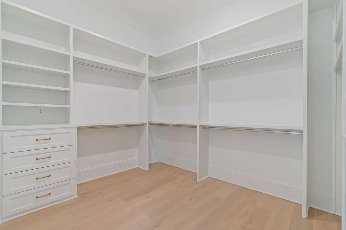 One side of the primary closet.