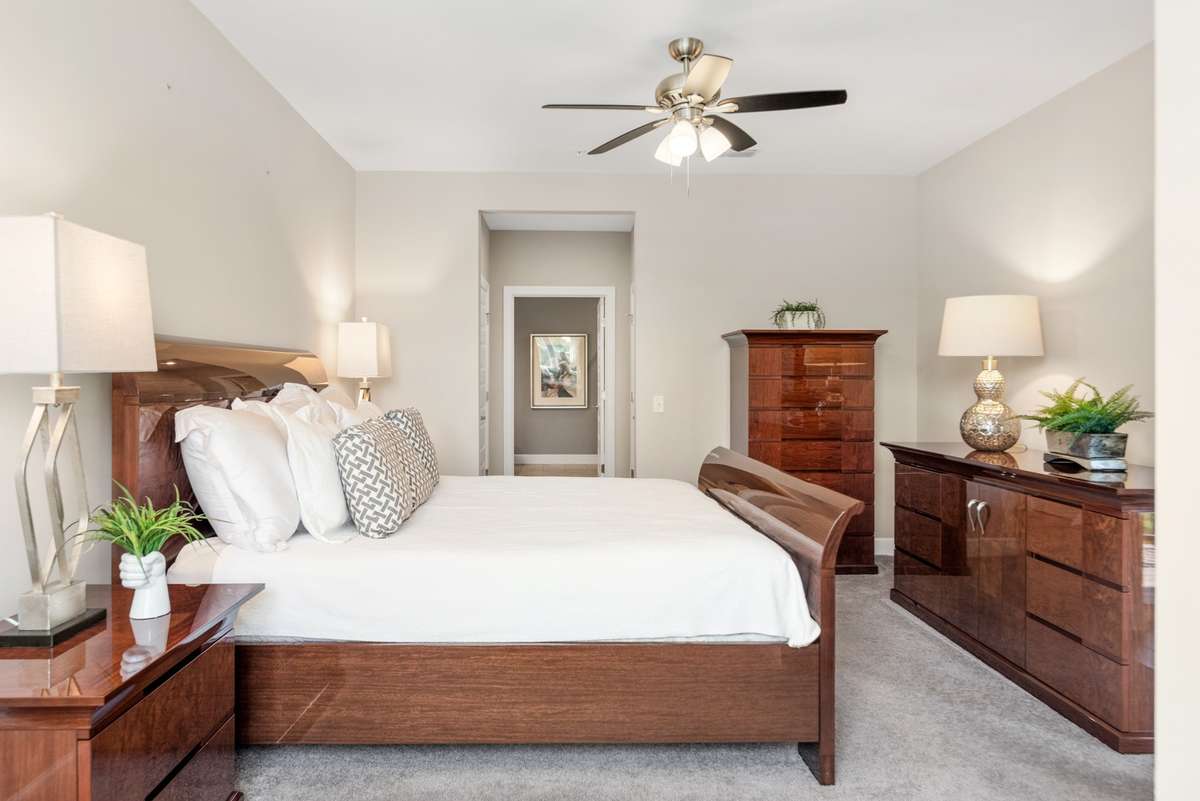 This room is massive and easily accomodates this King sleigh bed and the additional pieces to the  suite.