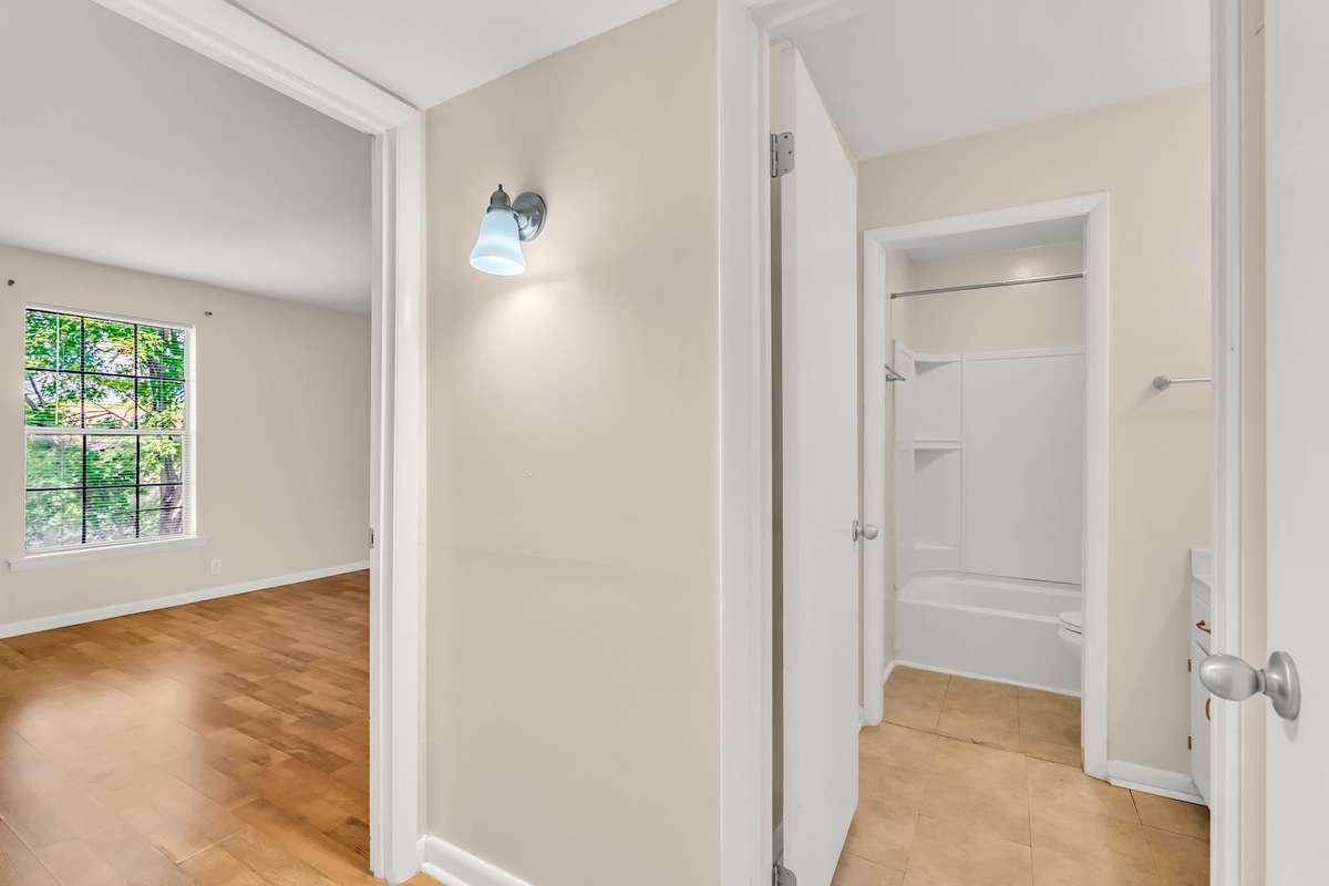 The bathroom is off of the hallway.
