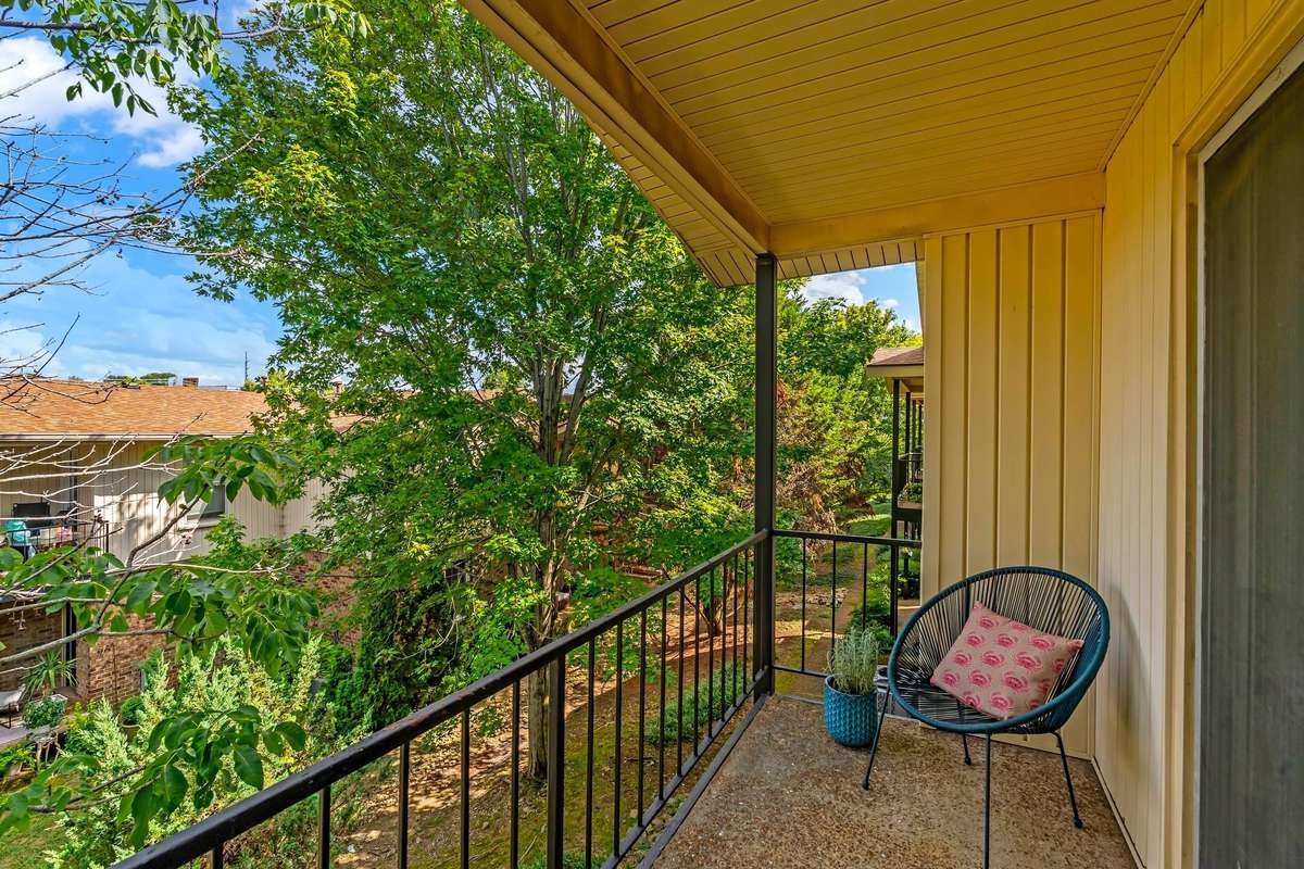 Enjoy the peaceful view from the private covered balcony.