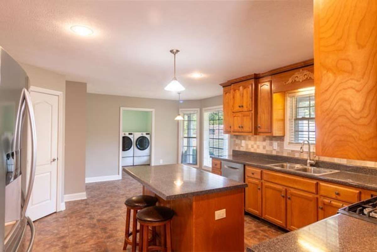 Kitchen-pantry in door to the left and laundry room through pocket door on the end