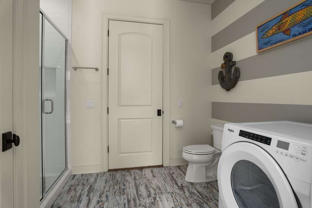 Pool bathroom with access from both the pool and the garage