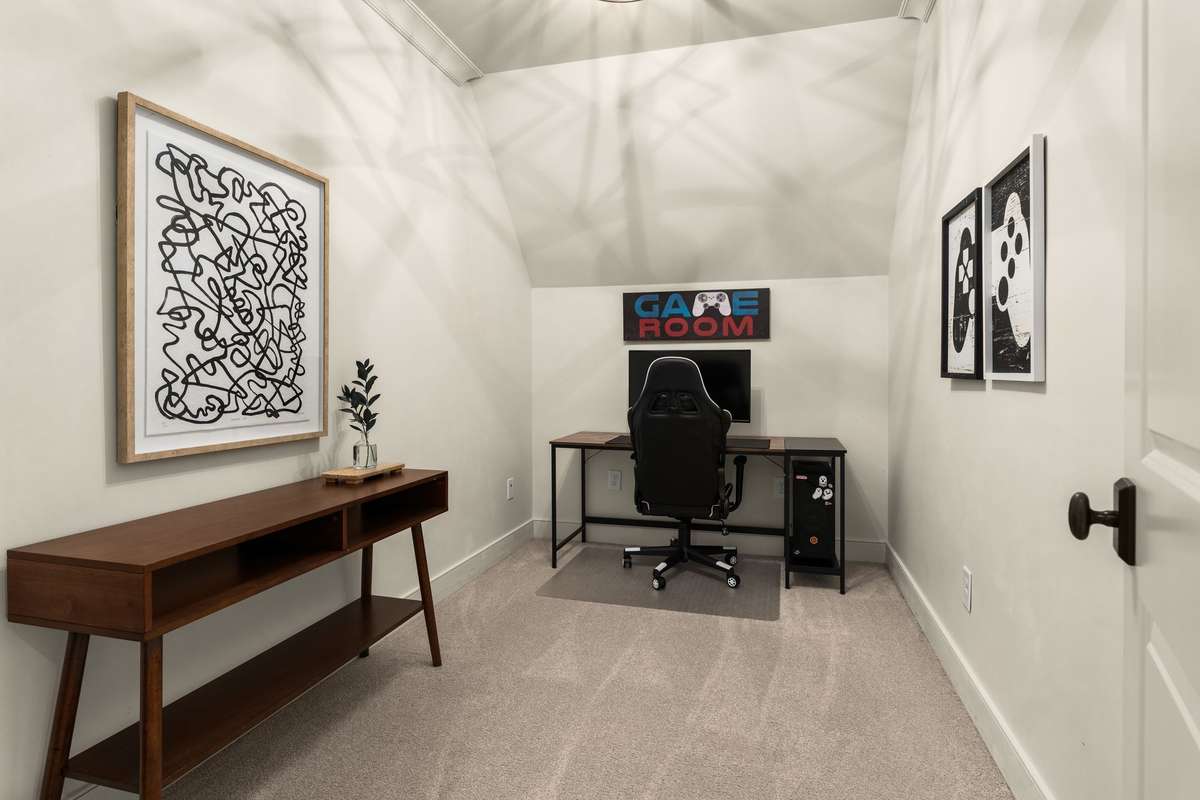 Flexible bonus room at the end of the upstairs hallway, currently set up as a game room