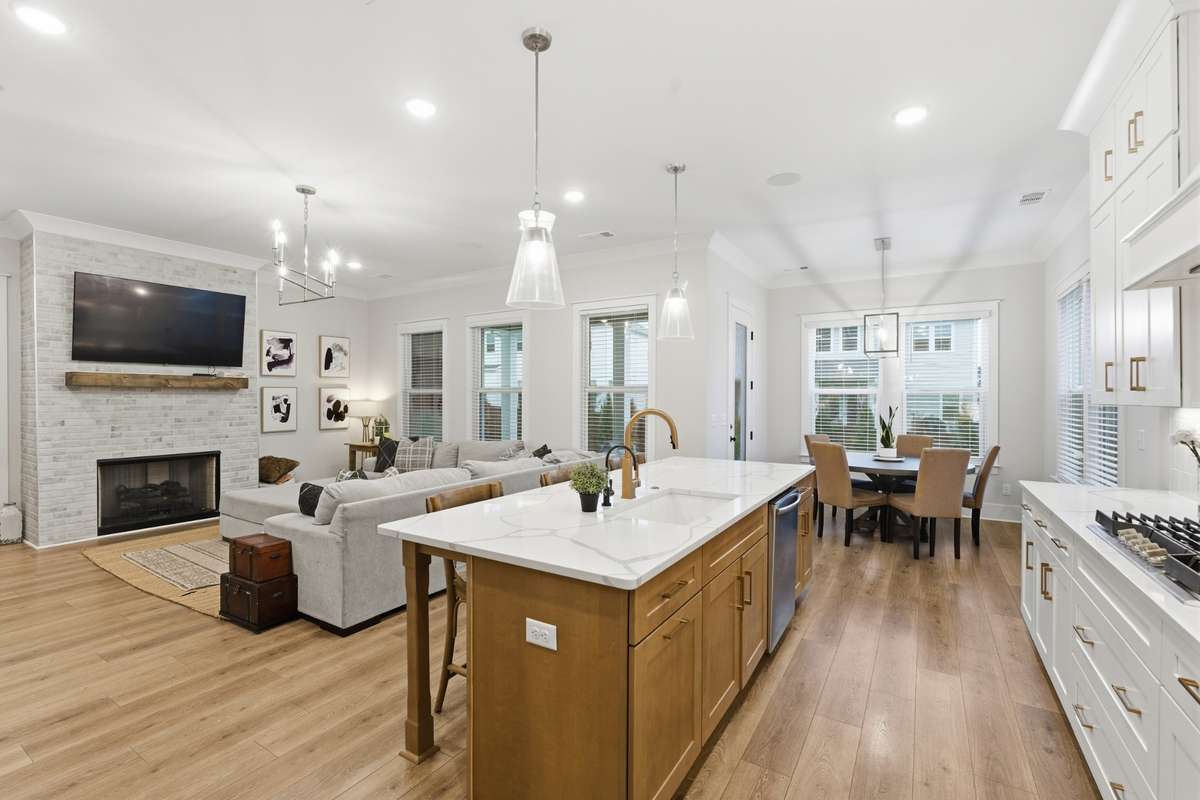 The open floor plan makes it easy to be together while enjoying your favorite show on the large screen TV, or to gather around the island.