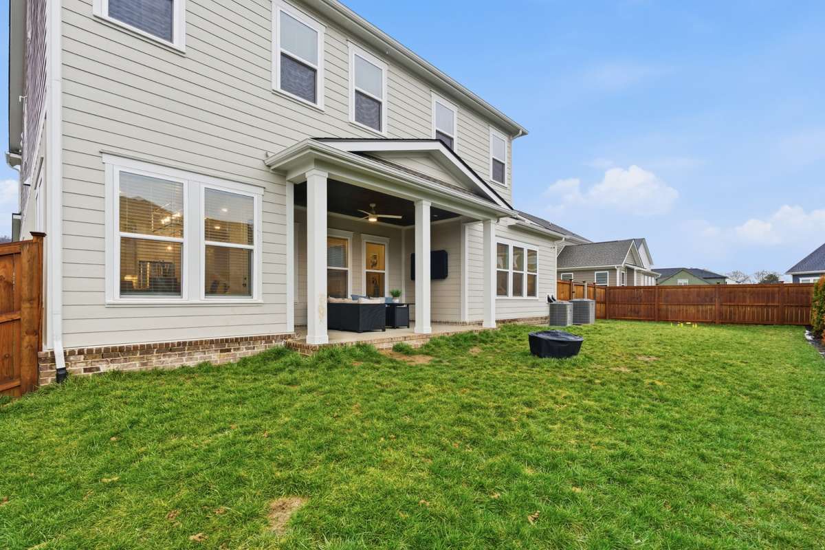 The large backyard boasts enough space for families to enjoy all their favorite games and hobbies.