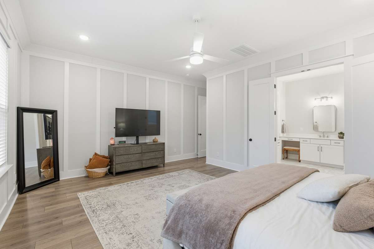 Just steps from the bed, the luxurious master bathroom awaits...