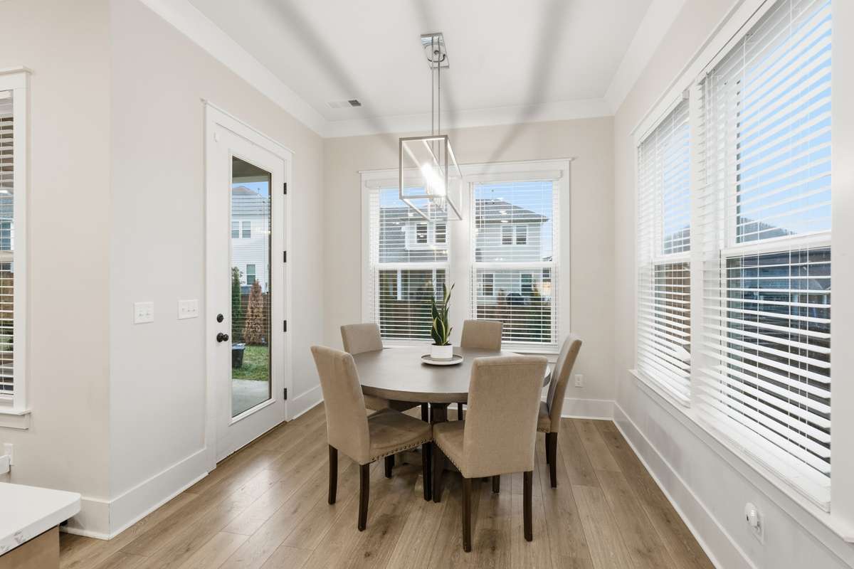 Complete with an exterior glass door, the in-kitchen dining area offers 360 degree views outside and the option to take your meal to the patio.