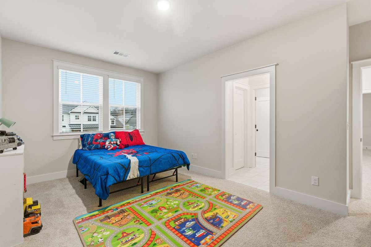 An off the room bathroom adorns this additional bedroom.