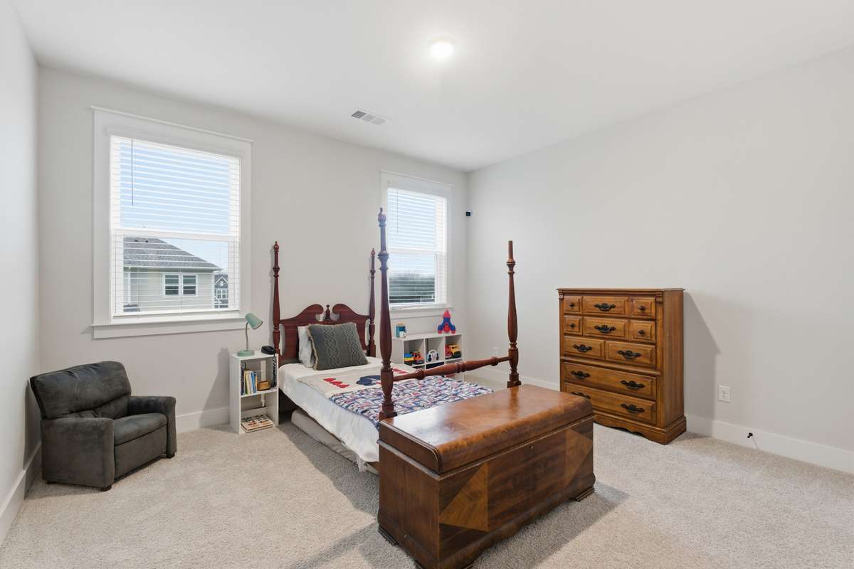 The secondary bedrooms offer a large space and have fresh carpet throughout. Complete with overhead lighting and large windows.