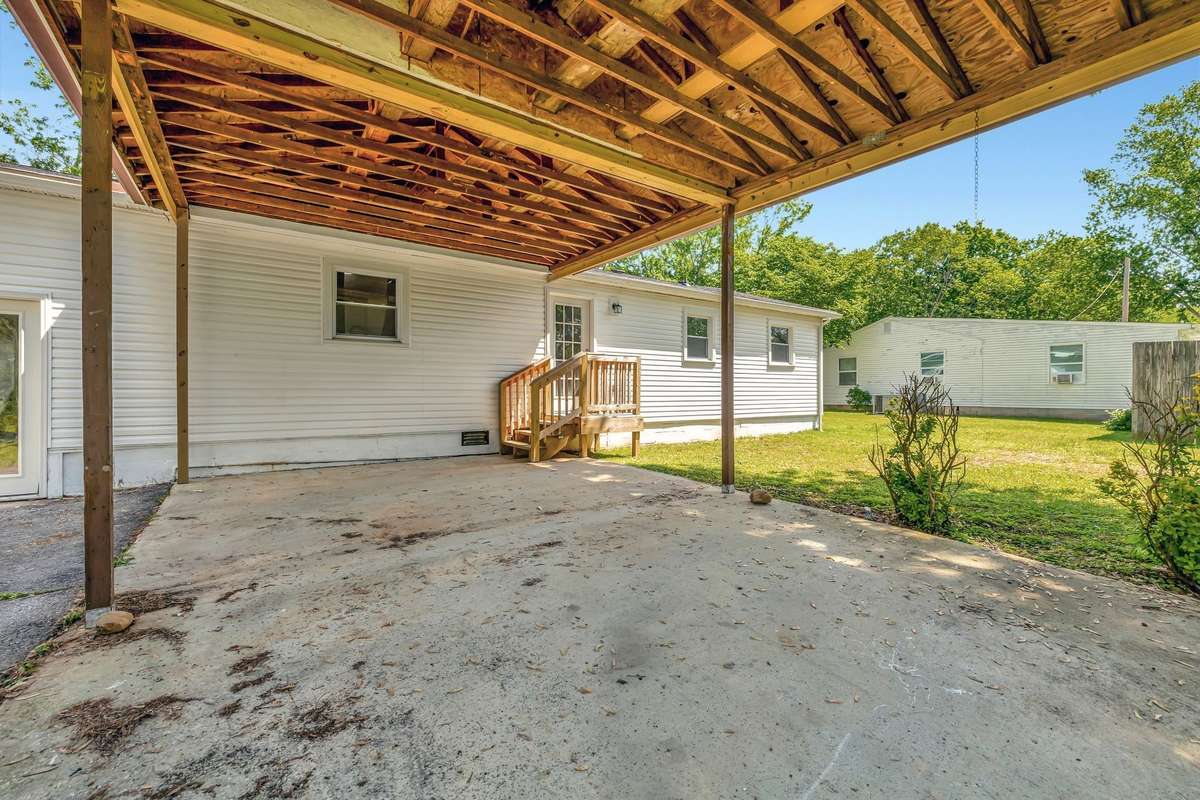 Wow! Love this carport attached to the back of the home