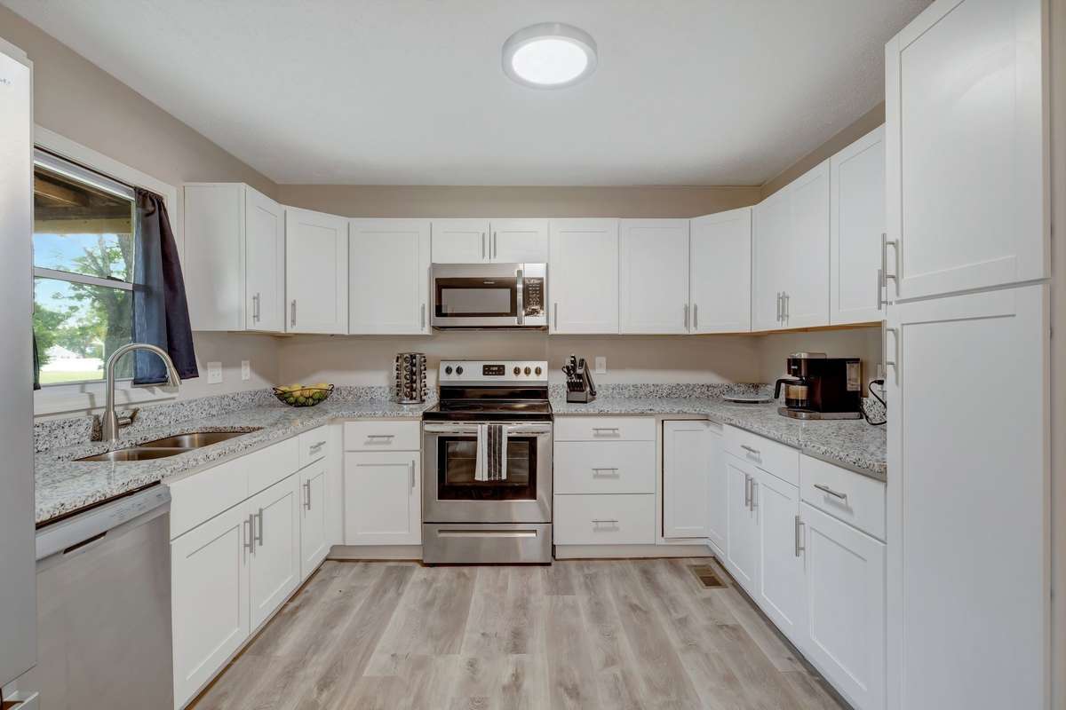 WIndow in kitchen overlooks backyard