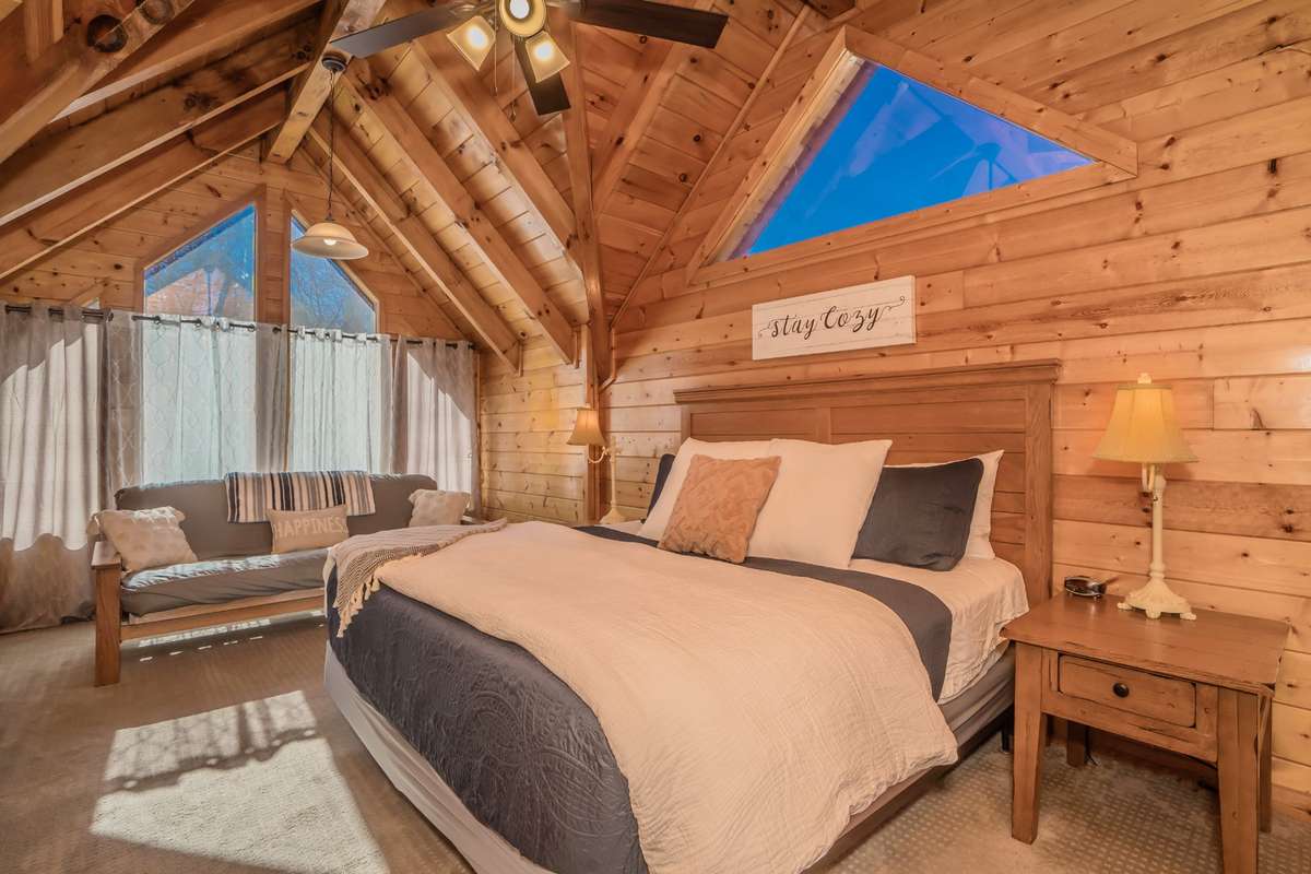 Primary bedroom with a king size bed and a futon bed(great for small children)
