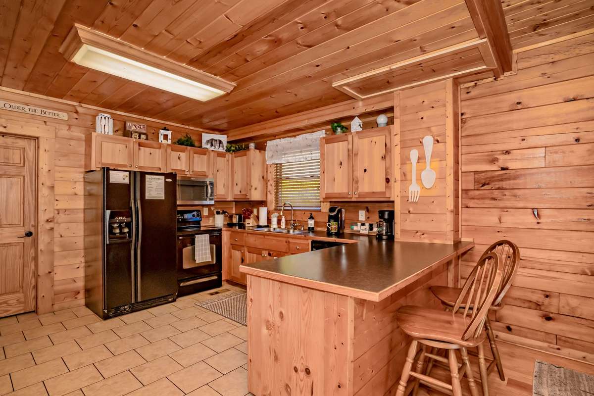 The fully equipped kitchen is complete with microwave, oven/stove and Keurig maker.
