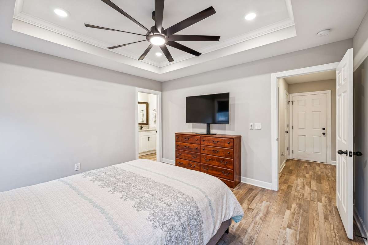 Oversize ceiling fan and recessed lighting in Primary Suite