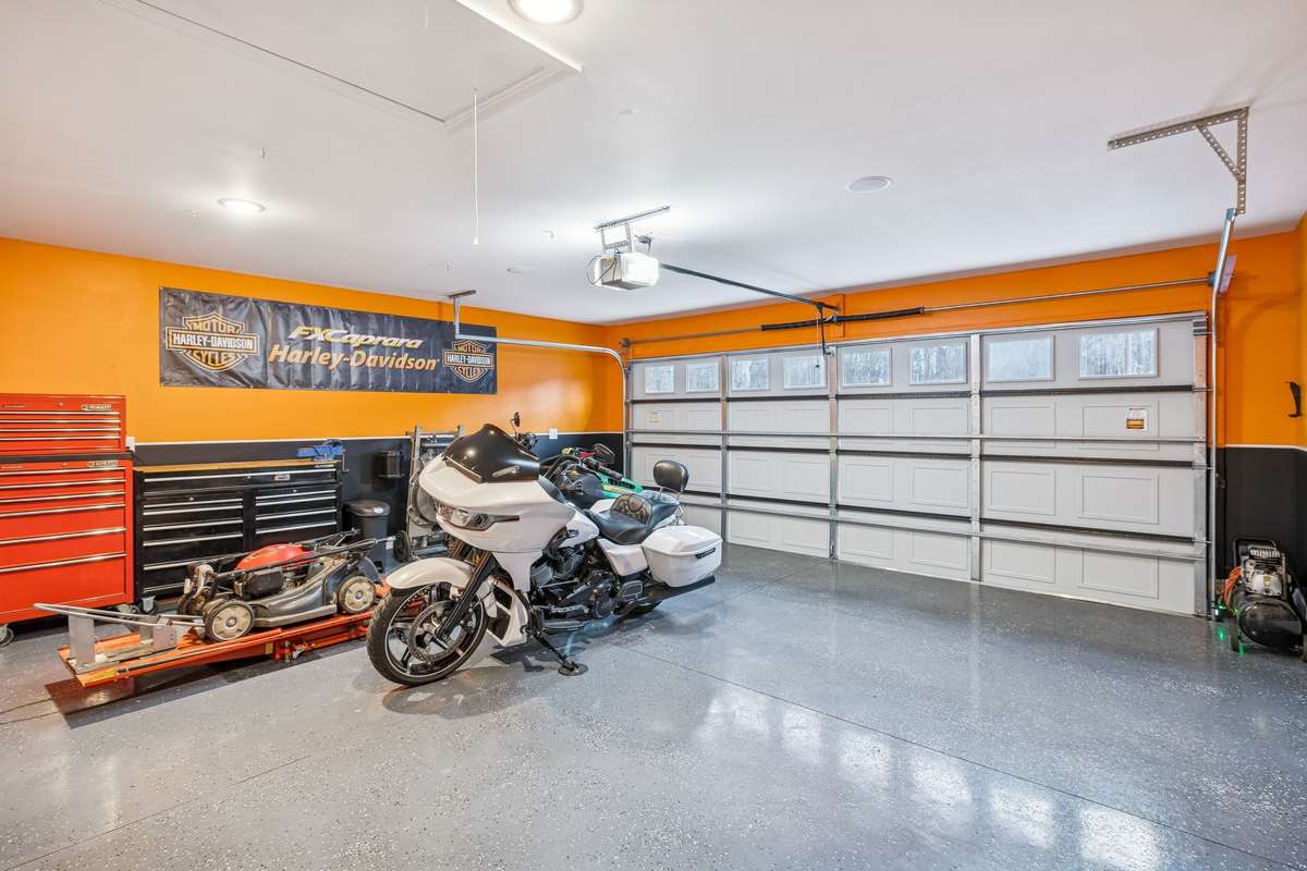 2 car garage with finished walls and floors.  Also, comes in integrated Bluetooth speakers
