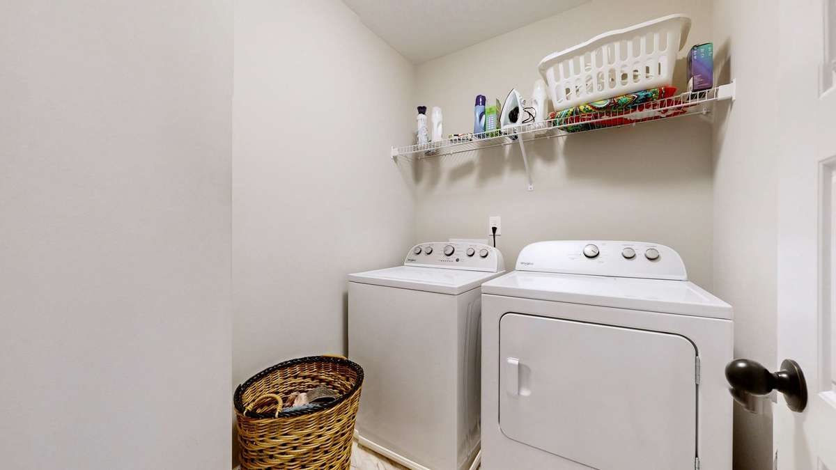 Full size laundry room is upstairs with the bedrooms.