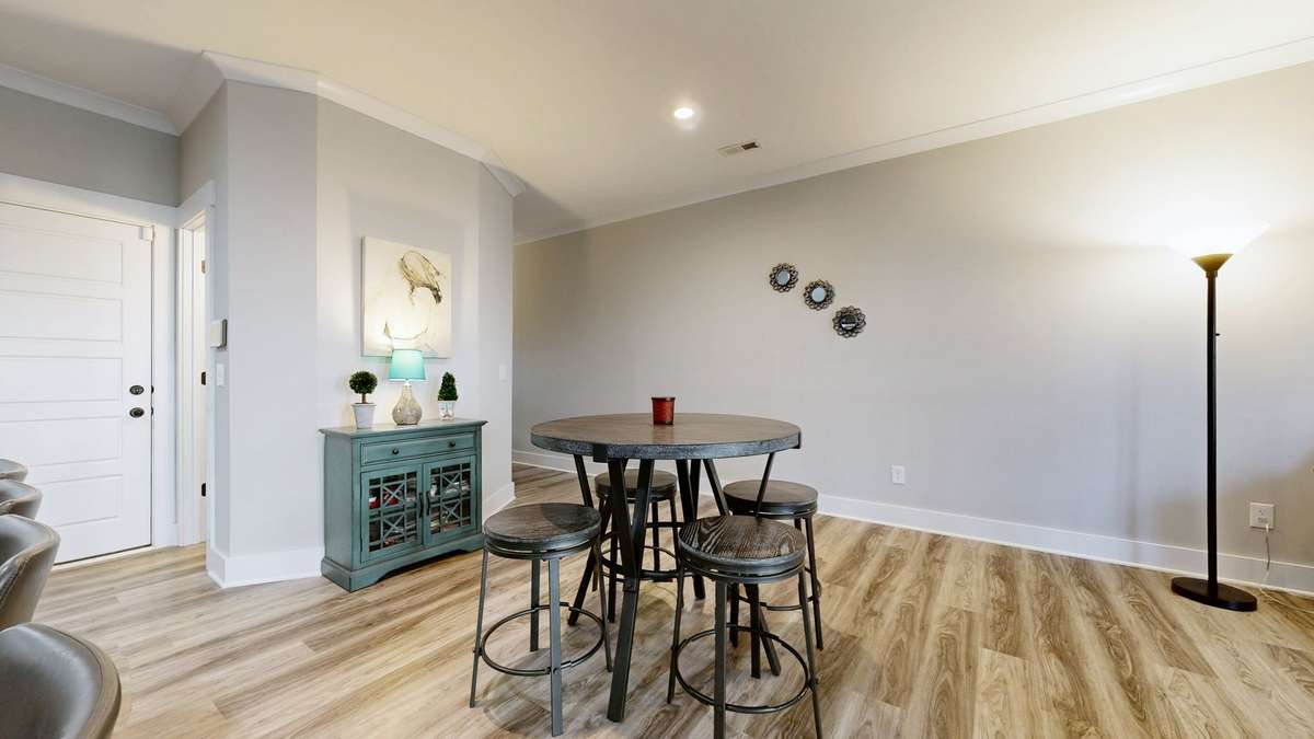 Dining area in open concept living/dining/kitchen.