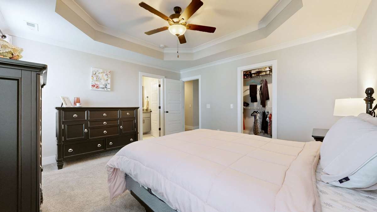Primary suite with walk-in closet.