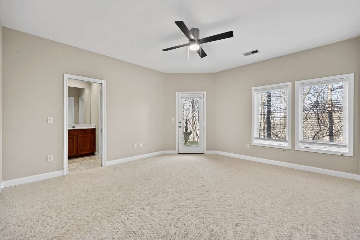 New carpet and natural light in downstair's owner's suite.