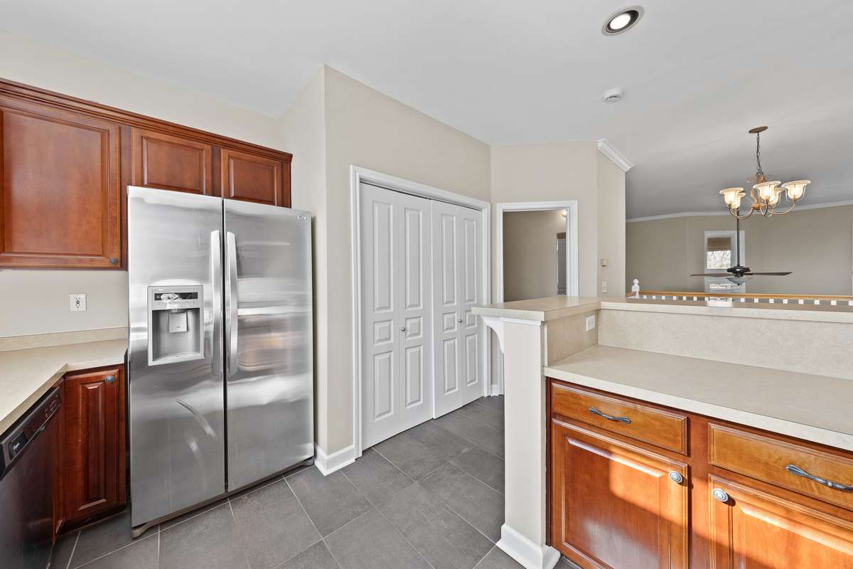 Stainless appliances, extra cabinets, washer and dryer included, and guest half bathroom.