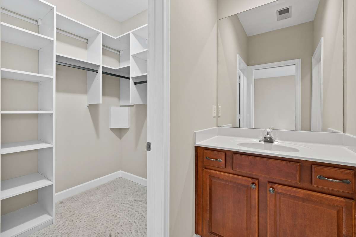 New California closets in downstair's suite (across from the tub/shower)