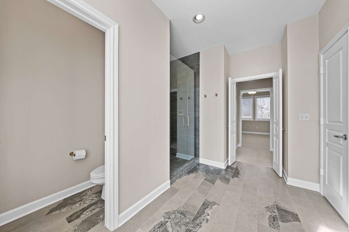 New tile (upstairs suite) stand up shower, towel closet across from shower.