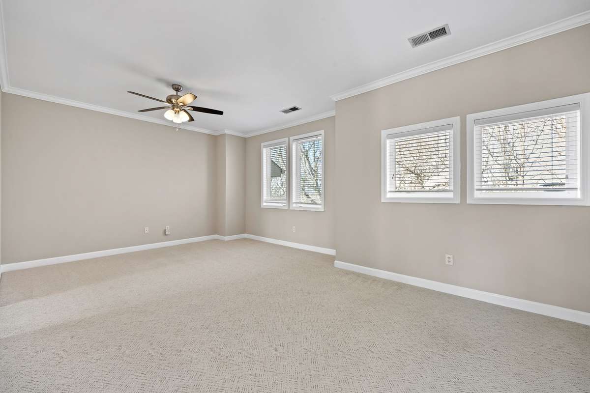 Spacious upstairs suite with new carpet and natural light.