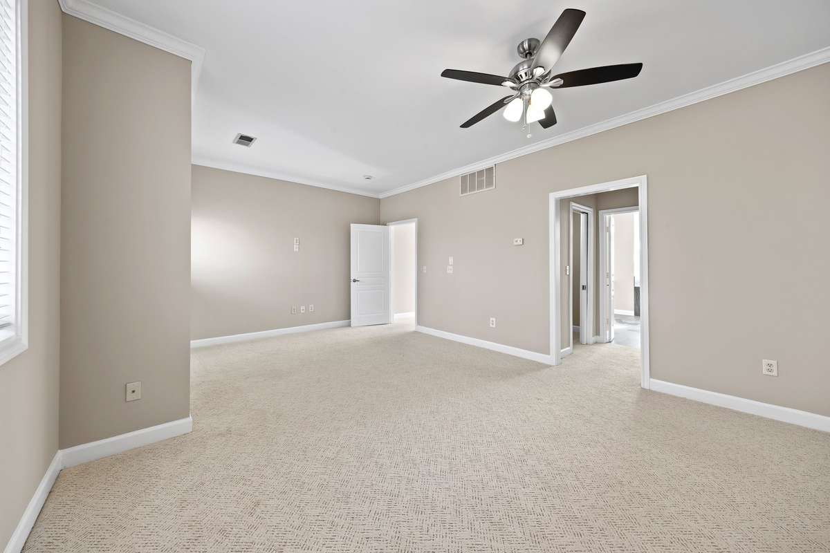 Two walk-in closets leading to the primary upstairs bathroom, fresh paint (Upstairs suite)