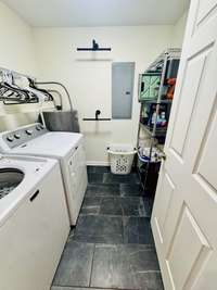 Great laundy with new tile, shelving and drying racks.  W&D stay!!