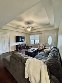 Spacious living room with trey ceilings