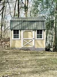 Good metal roofed outbuilding for storing lawn tools or whatever you need.