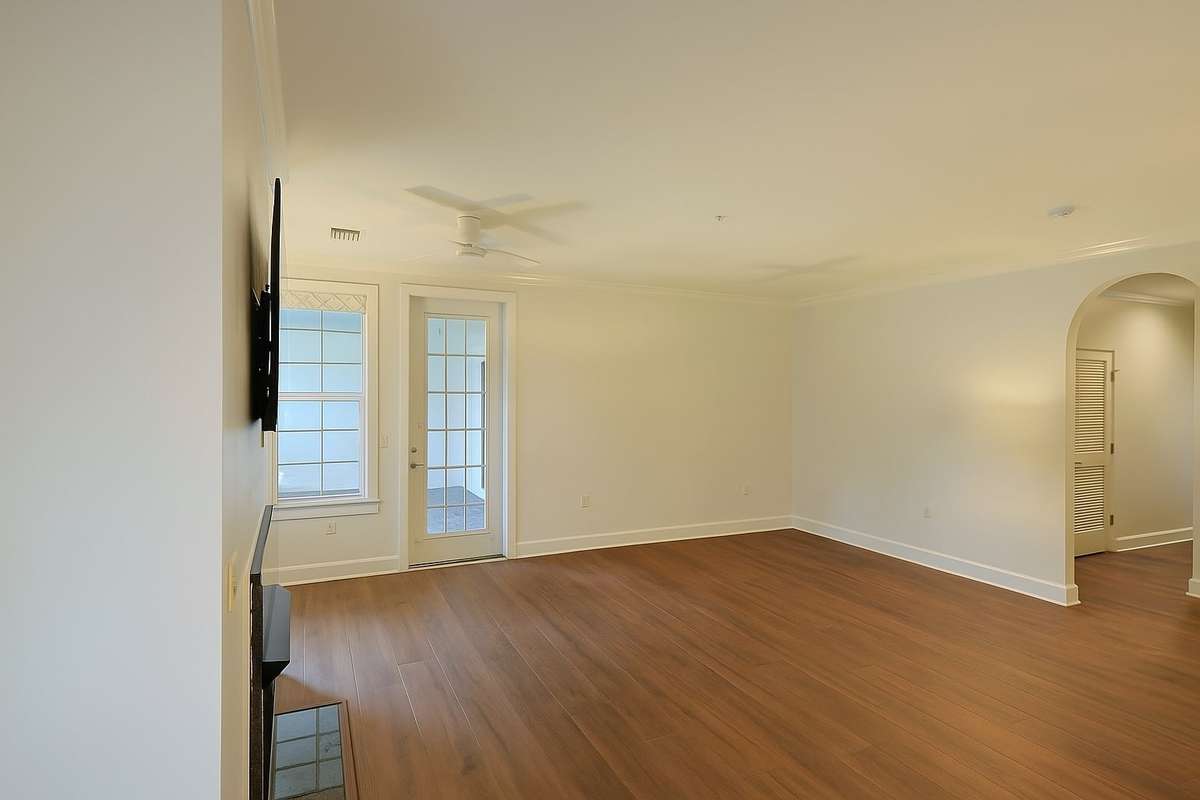 Photo has been altered with AI to show room with no furnishings.