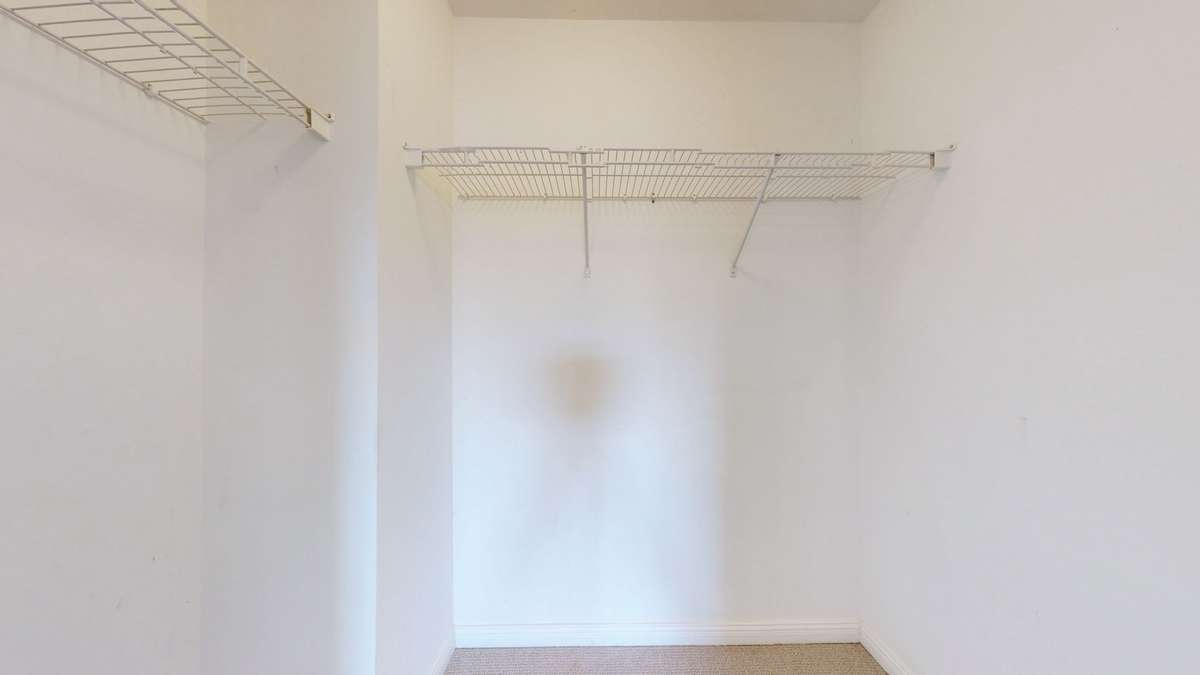 This walk in closet is bigger than it looks.  And it's right off the bathroom.