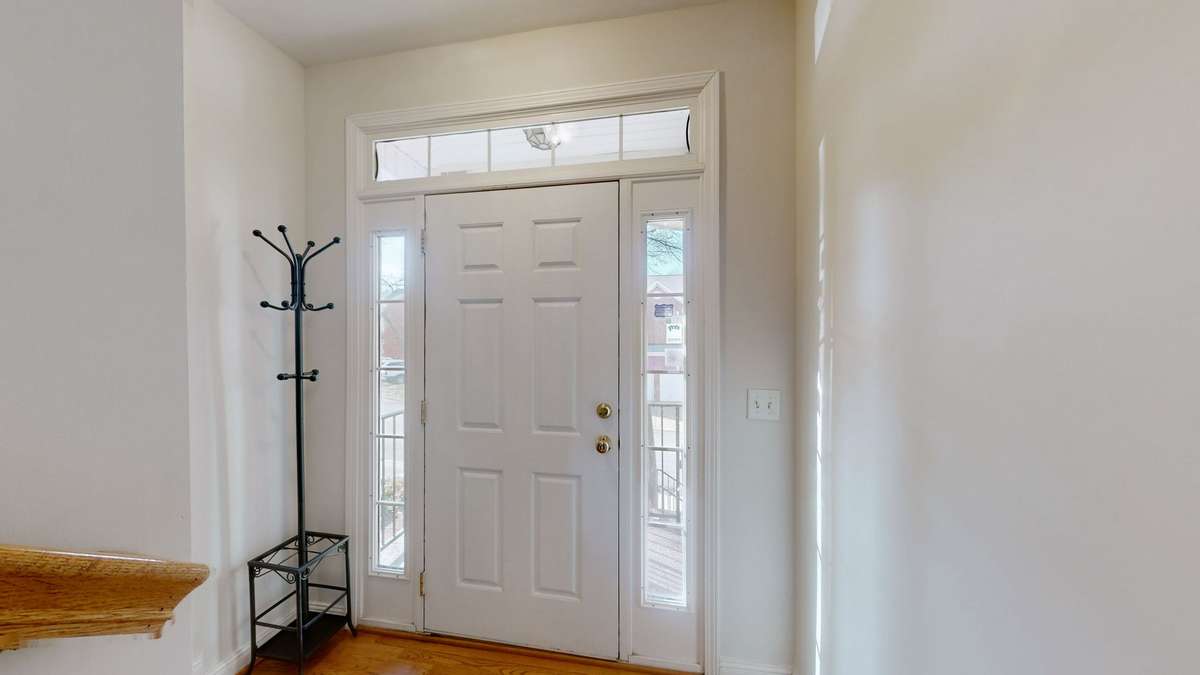 The main entrance foyer.  It's just 1/2 flight of stairs up from the garage and bonus room.  And 1/2 flight up to the main living area.