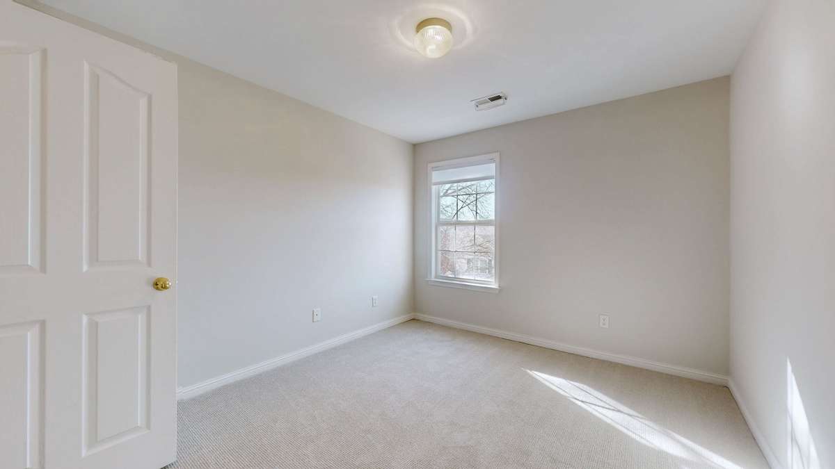 The first guest room has a walk in closet for even more storage.