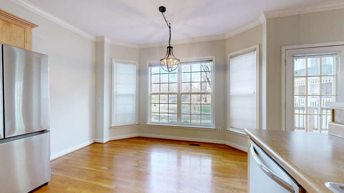 Such a lovely bay window!  Great place to enjoy your morning coffee.  Or you can always step out onto the deck!
