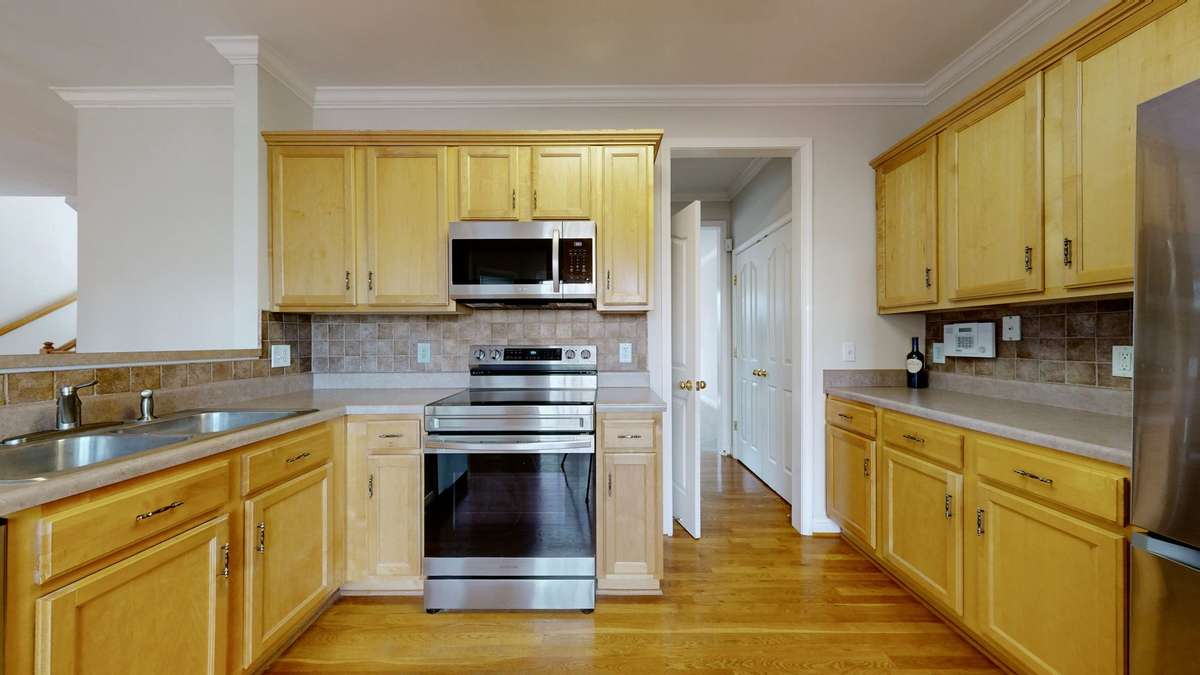 The hall into the Living Space is on the right.  The door on the right side is the pantry and the door on the left is the walk in laundry room.